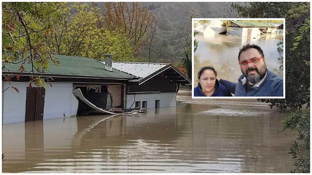 Donato Silvano con la compagna e il locale sommerso dalle acque