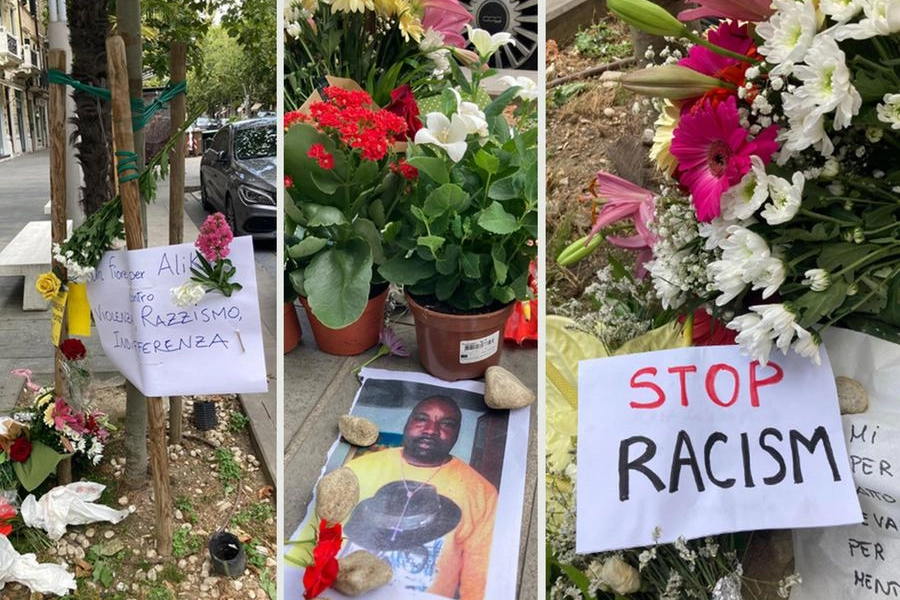 Fiori e messaggi sul luogo del delitto