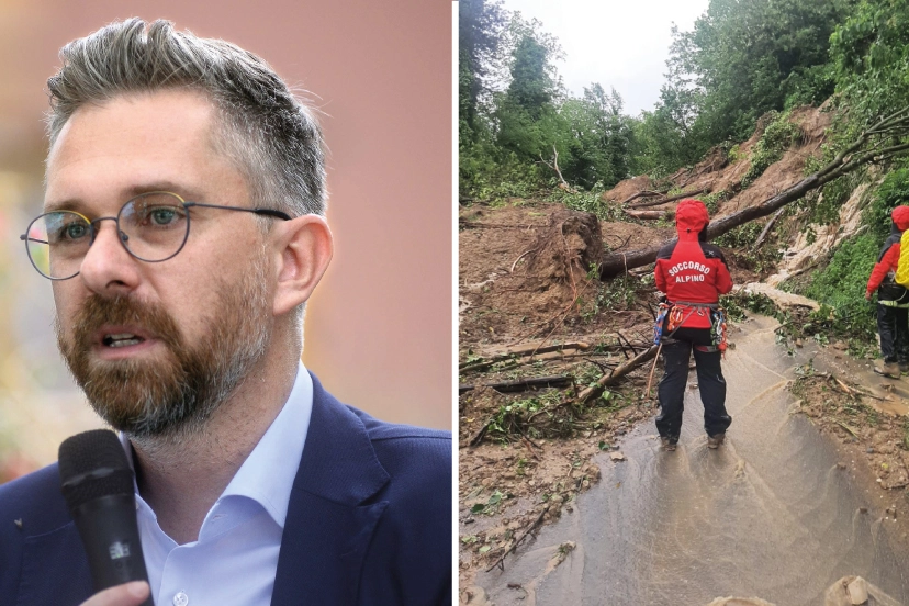 Il sindaco Matteo Lepore, accanto gli uomini del soccorso alpino ispezionano una frana