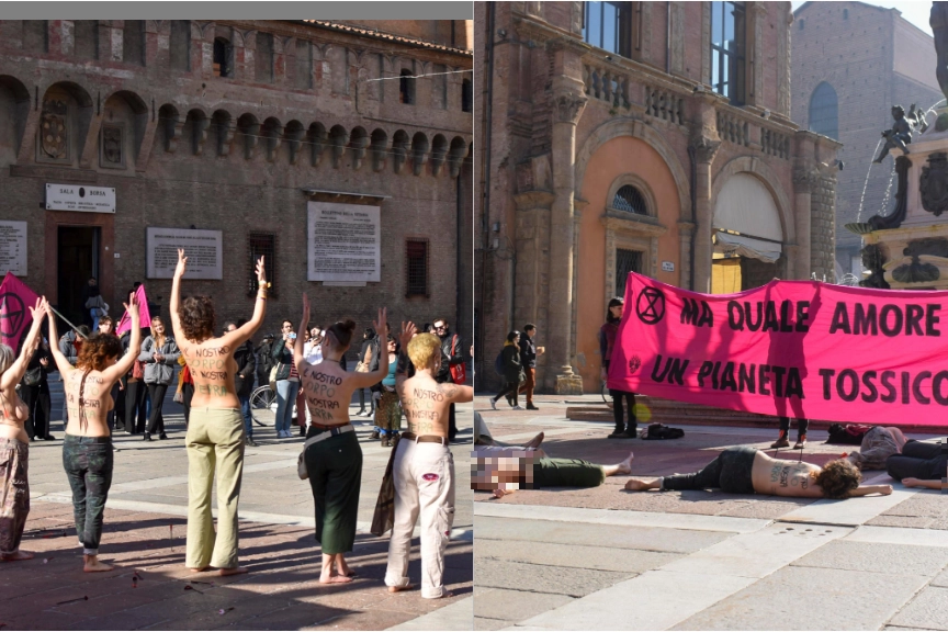 La protesta di San Valentino delle attiviste di Extinction Rebellion, che si sono denudate  in piazza  Maggiore