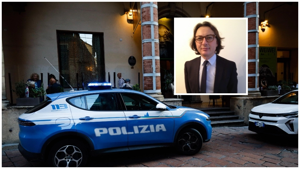 Un'auto della polizia e Tonino Guglielmi, segretario del Sap